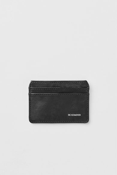 Close-up of The Carsten Cardholder by Deadwood, crafted from upcycled leather. It fits up to 7 credit cards and features the signature Deadwood logo in silver foil on the front, combining minimalism and sustainability.