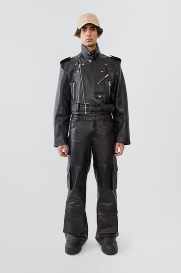 Men’s Dormi oversized black leather jacket by Deadwood, cropped boxy fit with asymmetrical front zipper and chunky belt, made from upcycled cowskin leather.