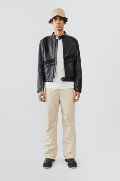Model in Hiro black leather jacket by Deadwood, inspired by Japanese motorcycle culture.