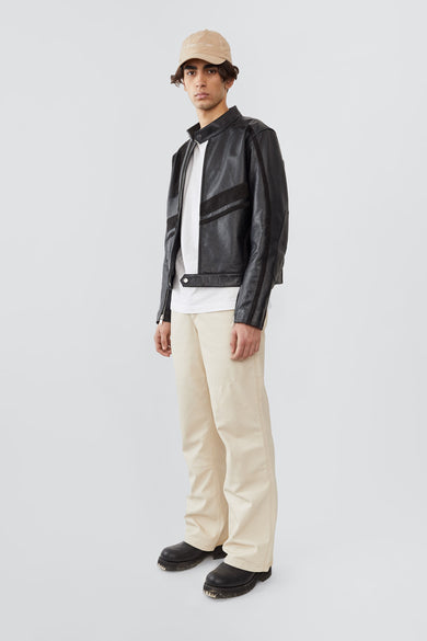 Side profile of model in Hiro black leather jacket by Deadwood, inspired by Japanese motorcycle culture.