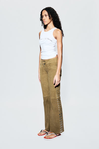 Dali Pants in olive by Deadwood on female model, side view, flared suede trousers with silver metal eyelets along the side seams.