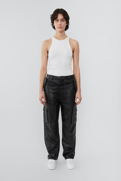 Model wearing straight cut cargo Deadwood pants with slightly dropped crotch, zip fly and workwear-inspired double waist pockets and leg pockets. One 32” length fits all.