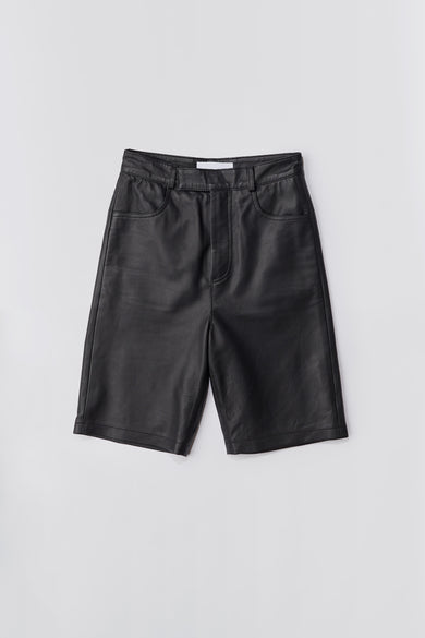 Deadwood black knee-length board shorts. Hook and zipper closure and right back pocket. Made from recycled leather.