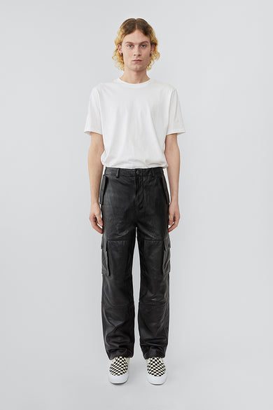 Model wearing straight cut cargo Deadwood pants with slightly dropped crotch, zip fly and workwear-inspired double waist pockets and leg pockets. One 32” length fits all.
