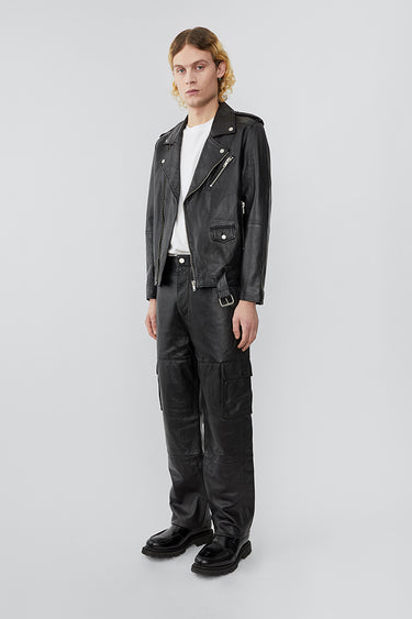 Model wearing Deadwood biker jacket, a classic rider style jacket that features all the right details including a practical inside pocket. Made from upcycled leather.