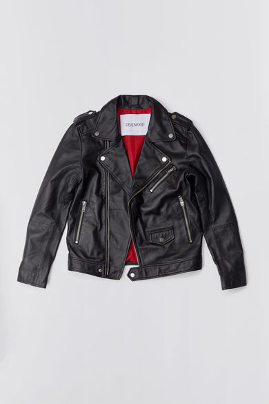 Black leather biker jacket with red lining, flat lay view.