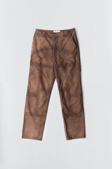 Brown Phil Suede Pants by Deadwood, featuring a brushed patchwork design, made from upcycled goat suede and lined with recycled PET fabric.
