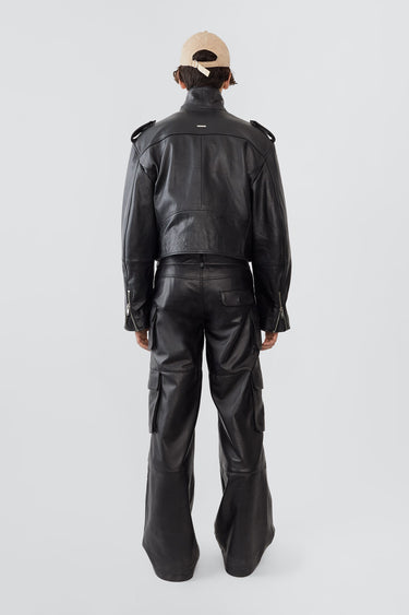 Back view of Dormi oversized black leather jacket by Deadwood, cropped design with just-above-waist length, made from upcycled leather.

