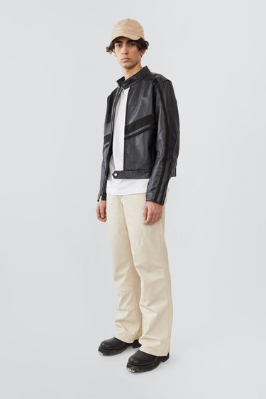 Side profile of model in Hiro black leather jacket by Deadwood, inspired by Japanese motorcycle culture.