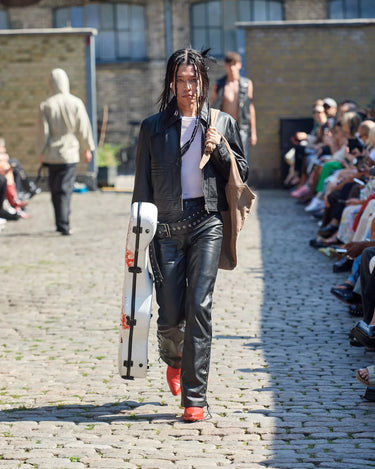 Male model on runway Black Gable Jacket and black leather pants from Deadwood Spring/Summer 2025 Collection during Copenhagen Fashion Week. The look features upcycled leather and recycled cotton, reflecting the brand’s commitment to sustainable fashion