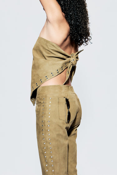 sideview of a multi-functional scarf top made from army green upcycled suede. Finished with eyelet detailing for adjustable styling. A statement in sustainability.