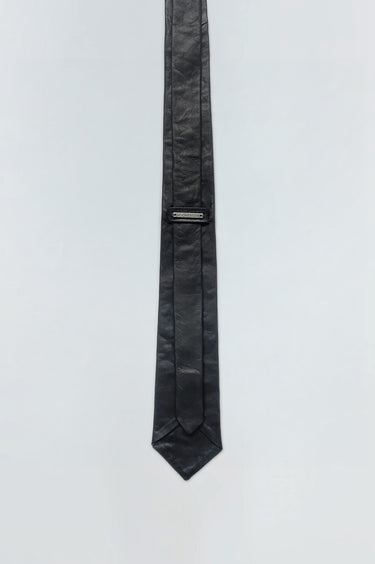 Backside of Timo Tie by Deadwood. Black leather tie made from upcycled lambskin with silver-tone logo detail.
