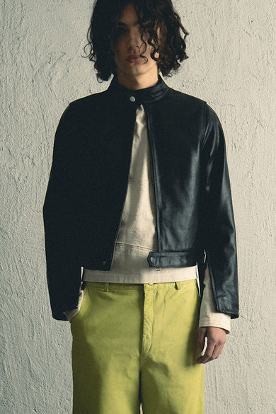 Velar leather jacket by Deadwood, front view with straight silhouette, center-front zipper, and button collar, made from upcycled grain cow leather.
