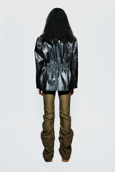 Back view of Ann Jacket by Deadwood on model, showing fixed gathered waist detail and sculpted back paneling in upcycled leather.