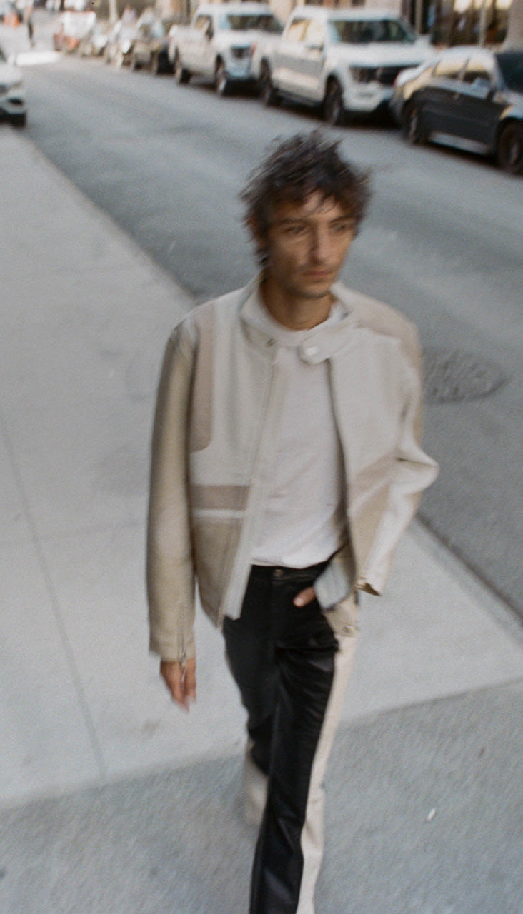 Model wearing Hiro jacket in cream from Deadwood. The look features upcycled leather, reflecting the brand’s commitment to sustainable fashion
