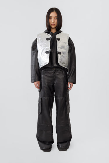 Front view of a female model wearing the Kapok Vest by Deadwood in Aluminium. Crafted from upcycled deadstock goat suede with a subtle brushed effect, this one-off sample style offers a relaxed, textured look.