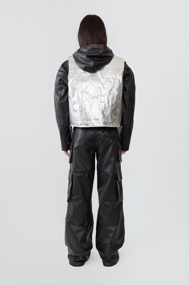 Back view of a female model wearing the Kapok Vest by Deadwood in Aluminium. Crafted from upcycled deadstock goat suede with a subtle brushed effect, this one-off sample style offers a relaxed, textured look.