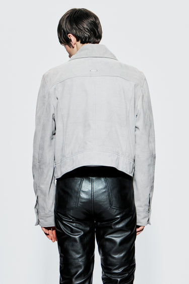 Close up back view of Deadwood’s Porter Pants on male model, featuring jean-style back pockets and smooth lambskin leather finish.