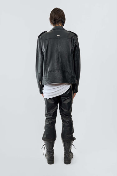 Back view of model wearing the River black biker jacket made from upcycled lambskin.
