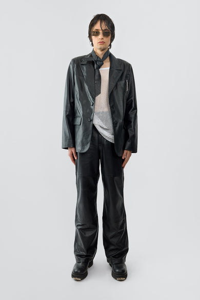 Stanley black leather blazer by Deadwood worn by male model, front view, single-breasted with two-button closure, chest pocket, and duo waist pockets, made from upcycled lambskin.