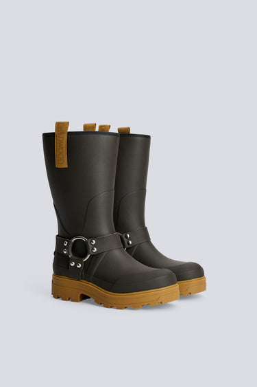 Pair of dark brown rain boots with brown soles on a light gray background