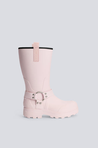 Pink rain boot with a strap on a light gray background