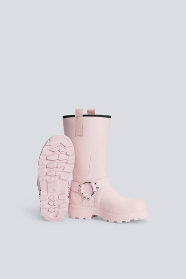 Pink rain boots on a light gray background
