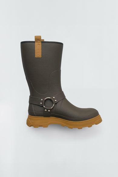 Dark brown rubber boot with a brown sole on a light gray background