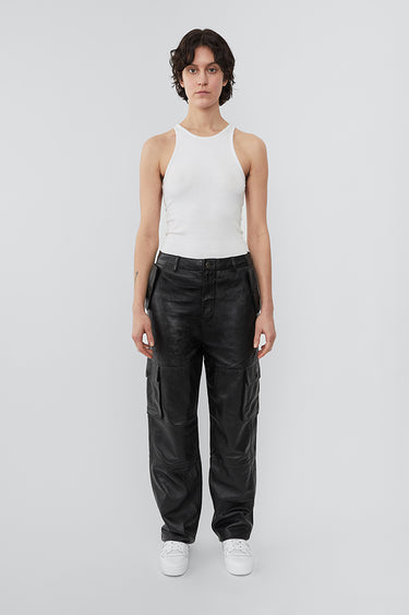 Model wearing straight cut cargo Deadwood pants with slightly dropped crotch, zip fly and workwear-inspired double waist pockets and leg pockets. One 32” length fits all.