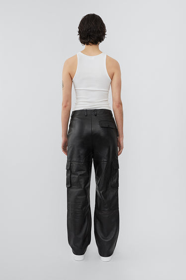 Model wearing straight cut cargo Deadwood pants with slightly dropped crotch, zip fly and workwear-inspired double waist pockets and leg pockets. One 32” length fits all.