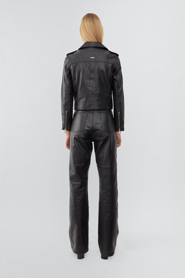 Model wearing Joan jacket, with a cropped cut and features all the right details including a practical inside pocket. Made from recycled leather.