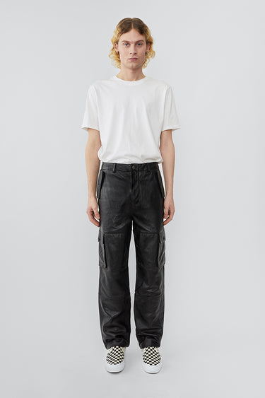 Model wearing straight cut cargo Deadwood pants with slightly dropped crotch, zip fly and workwear-inspired double waist pockets and leg pockets. One 32” length fits all.