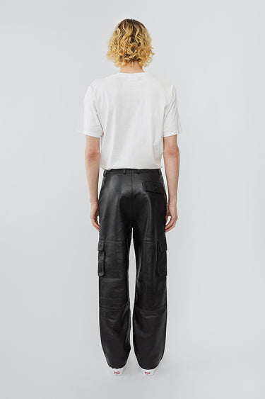 Model wearing straight cut cargo Deadwood pants with slightly dropped crotch, zip fly and workwear-inspired double waist pockets and leg pockets. One 32” length fits all.