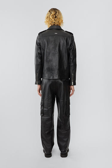 Model wearing Deadwood biker jacket, a classic rider style jacket that features all the right details including a practical inside pocket. Made from upcycled leather.   