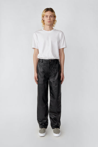 Model in black Presley recycled leather pants by Deadwood, high-waisted wide-leg design with workwear details.