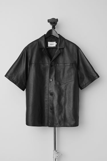 Bahama black leather short sleeve shirt by Deadwood, inspired by vintage Hawaiian shirts, made from upcycled lambskin leather with a recycled PET lining.
