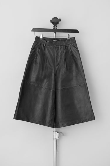 Extra wide Deadwood shorts in color black. Mid to high rise. Front lapels. Made from recycled leather.