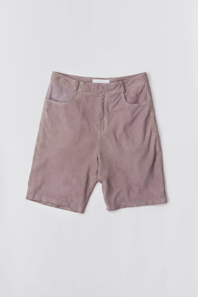 Deadwood knee-length suede board shorts in the color lavender. Hook and zipper closure and right back pocket. Made from recycled suede.