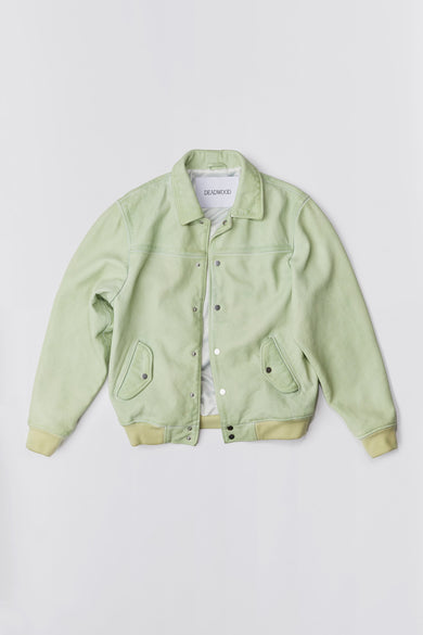 Varsity-inspired Deadwood jacket with cotton rib at cuffs and bottom hem, tilted front flap pockets and push buttons at center-front. In color lime. Made from recycled cow leather.