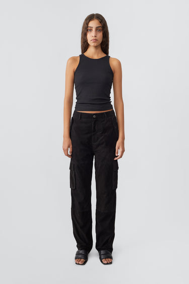 Model in black Convoy Suede Pants by Deadwood, workwear-inspired cargo pants in upcycled goat suede with a tapered fit and eco-conscious materials.