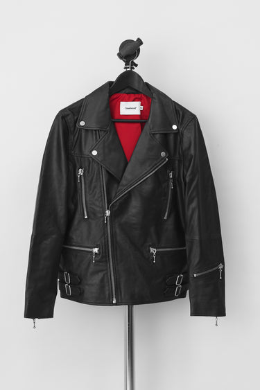 Deadwood black leather jacket with ball and chain zippers and red lining. Pockets at waist and chest.