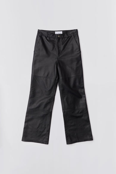 Wide straight cut Deadwood leather pants with high waist, zip fly and workwear inspired front pocket detail. Flattering jean style back pockets. Made from recycled leather.