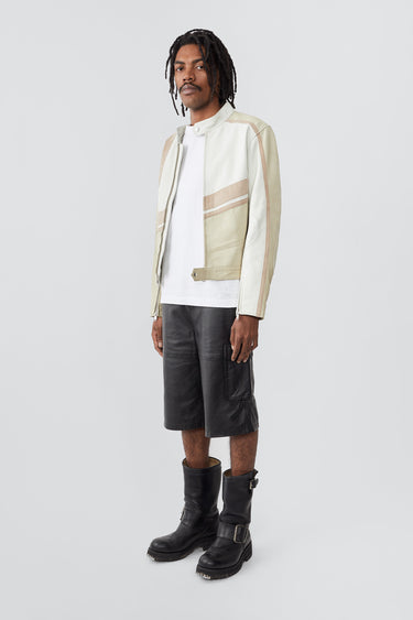 Side profile of model in Hiro off-white leather jacket by Deadwood, inspired by Japanese motorcycle culture.